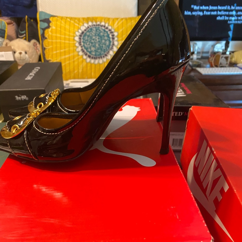Black patten leather, size 7 heels.